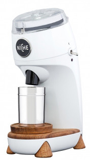 Niche Zero modern coffee grinder showcasing its sleek design, transparent top, and wooden base.