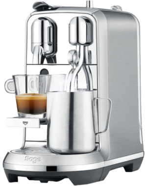 Sage Nespresso Creatista Plus espresso machine with freshly brewed coffee and milk frothing jug.