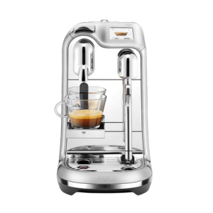 Creatista® Nespresso Vertuo espresso machine brewing a cup of coffee with milk frother arm.