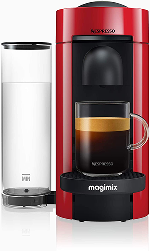 Nespresso Vertuo coffee machine by Magimix in vibrant red with a glossy finish and fresh brewed coffee cup.