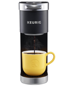 Keurig K Mini Plus coffee maker brewing coffee into a bright yellow mug.