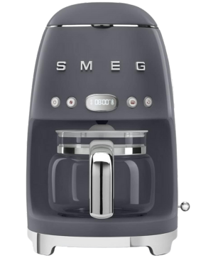 SMEG DCF02GRUK coffee maker in a sleek, muted gray design with digital display and glass carafe.