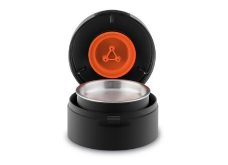 Pourover adapter cylindrical device with metallic disc and bright orange indicator within.